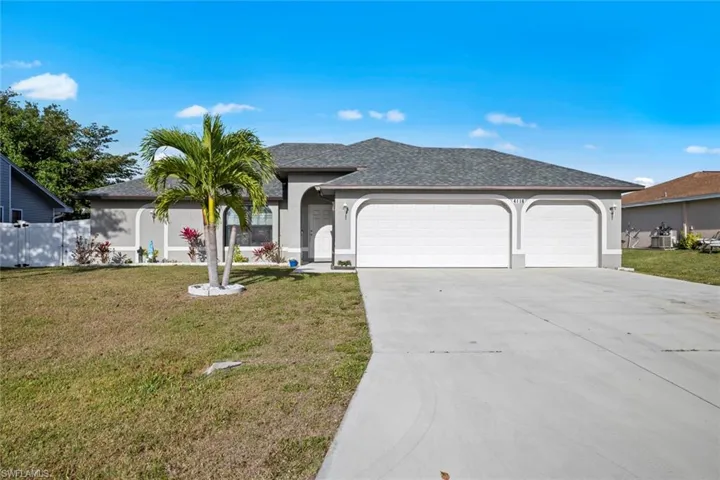Ranch-style house featuring stucco siding, roof with shingles, a front yard, an attached garage, and concrete driveway