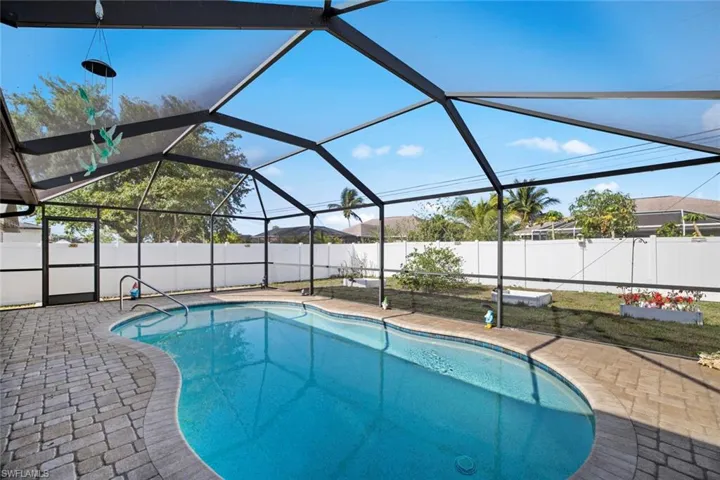 View of swimming pool with a patio area, a fenced backyard, a fenced in pool, and a lanai