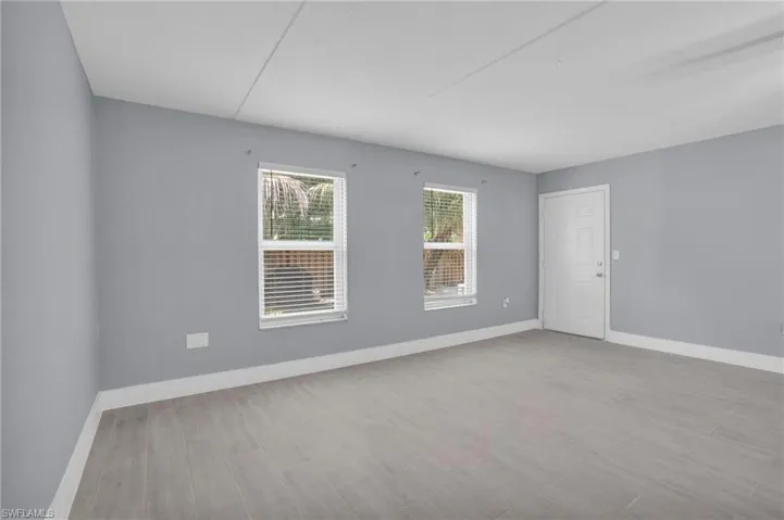 Spare room with light wood-type flooring