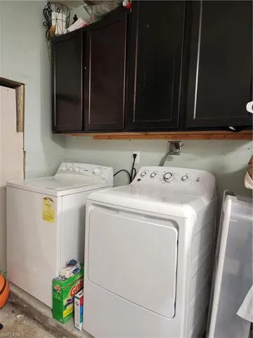 Laundry area with washing machine and dryer and cabinet space
