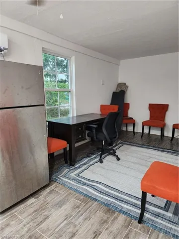 Office with refrigerator, bathroom, sink and a wall AC unit - Pic 1