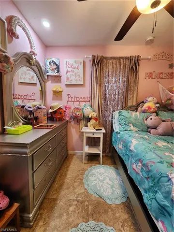 Second Bedroom with ceiling fan and tile floor - Pic 1