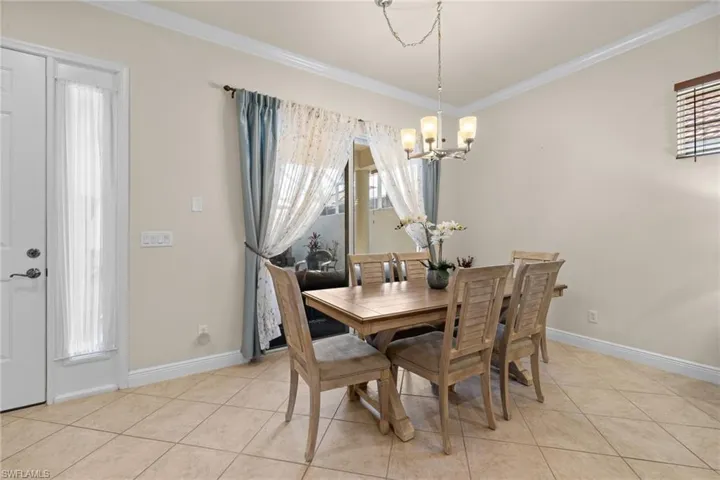 Dining area and dining table. Neutral tones throughout villa home.