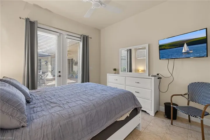 Cabana room 'flex' space as a guest suite, office or studio. Looking onto the private courtyard with lovely French doors.