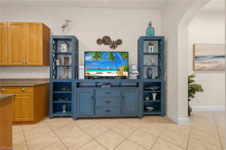 Kitchen bonus area showing plenty of room for bookcases and tv armoire.