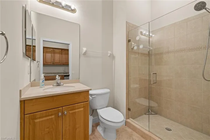 Ensuite full Bathroom to Cabana with vanity, toilet and newly enclosed glass doors for walk-in shower.