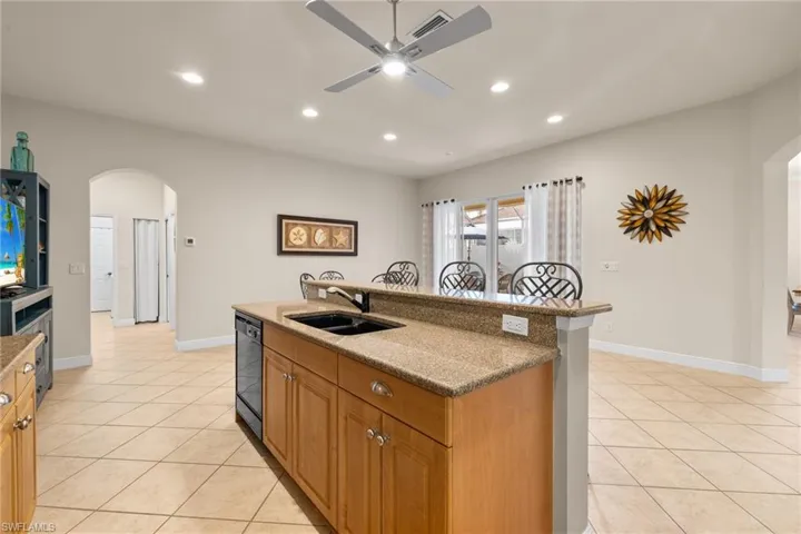 Kitchen area looking out onto the sizable 'flex' space. Dine in or turn into a family room with comfy chairs and side tables. A lot can be done with this room.