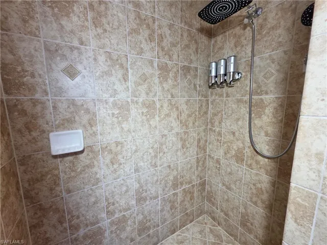 Full bathroom with a tile shower