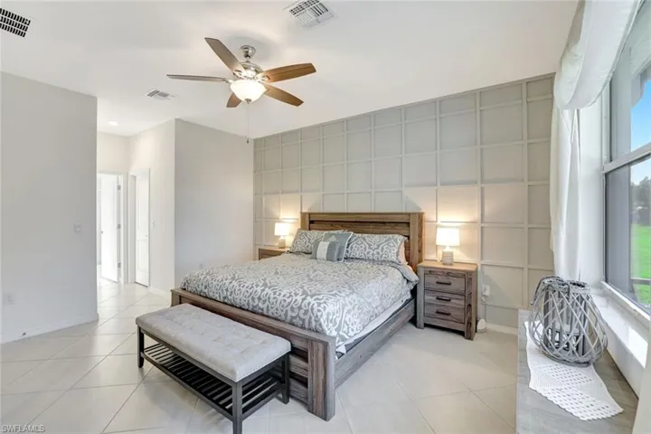Bedroom featuring visible vents, baseboards, and light tile patterned flooring