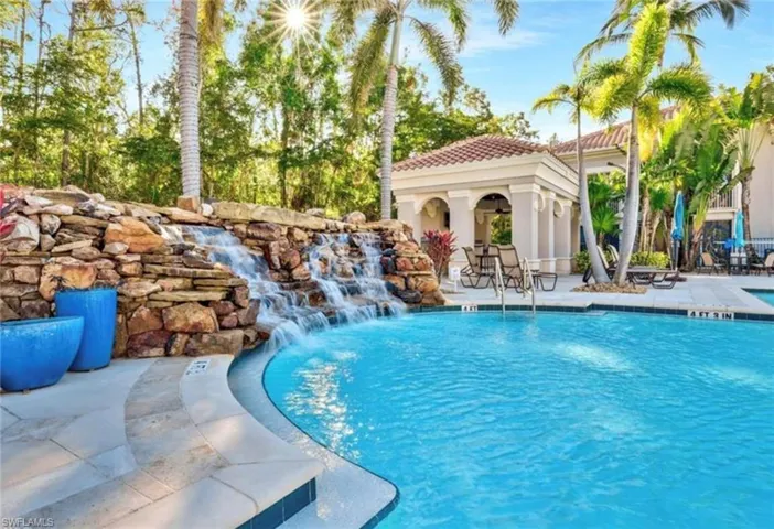 Pool featuring an outbuilding and a patio