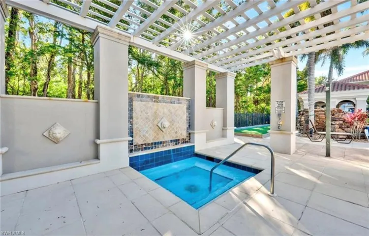 View of pool with a pergola, fence, and a patio