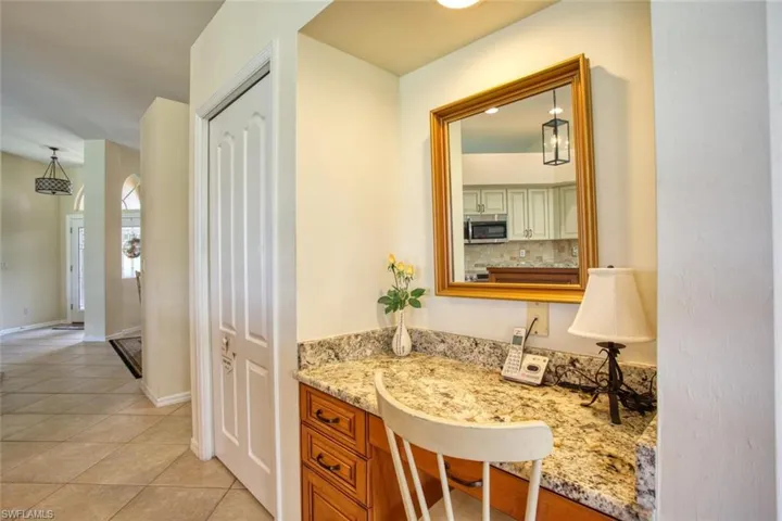 Bathroom featuring tasteful backsplash and tile floors