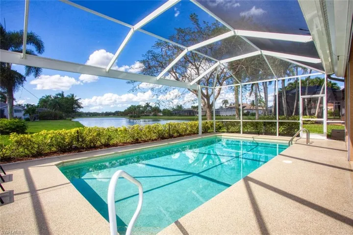 View of pool with a water view, a patio, screen enclosure, and views down the lake