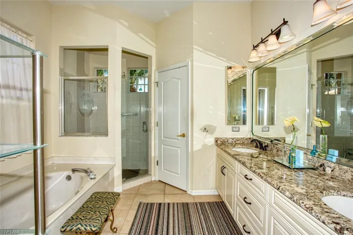 Bathroom with vanity, independent shower and bath, and tile floors