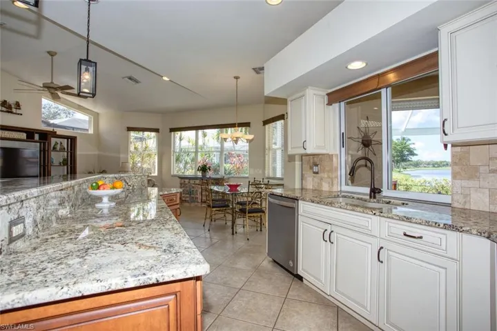 Kitchen with views of the lanai and pool