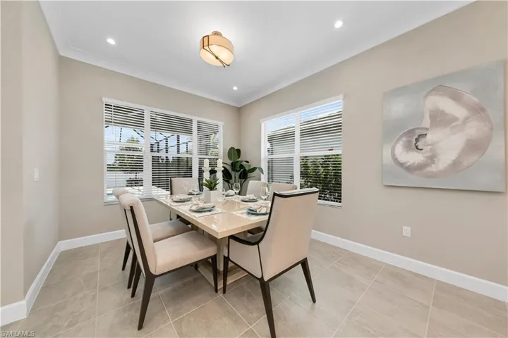 Tiled dining area with crown molding