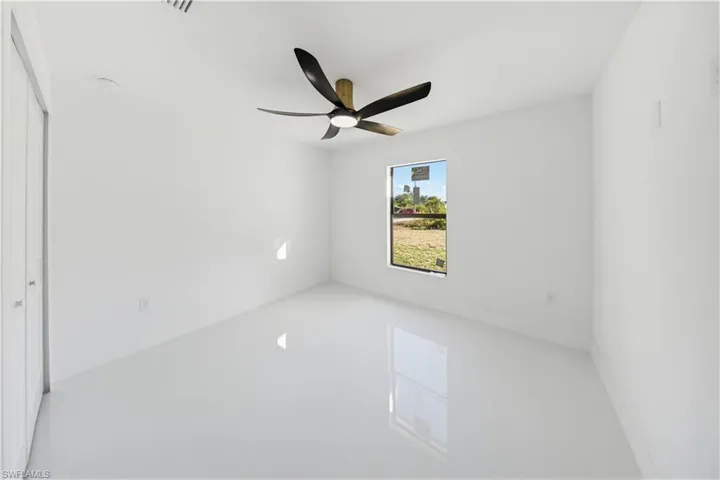 Unfurnished bedroom with a closet and ceiling fan