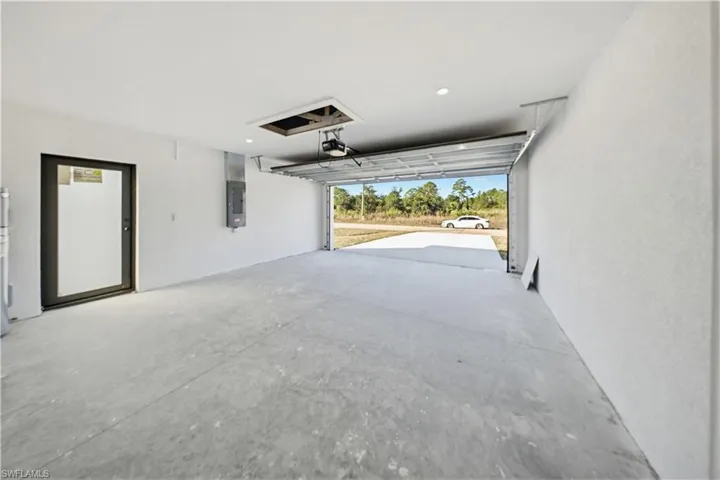 Garage featuring electric panel