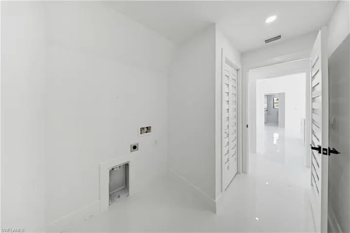 Laundry room with washer hookup, electric dryer hookup, and recessed lighting