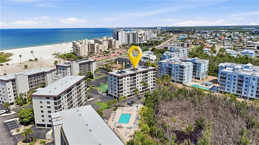 Coastal community featuring multiple multi-story residential buildings - Virtually Edited Image