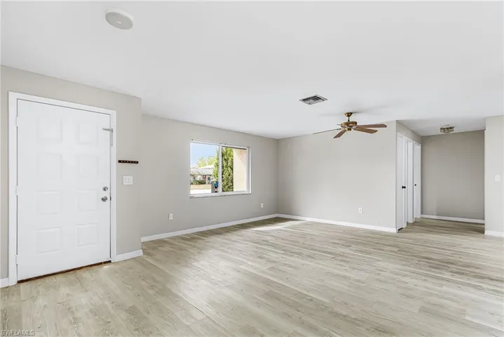Entry to the Living Room.  All new solid surface, low maintenance flooring throughout the home.