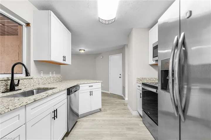 Note solid surface, low maintenance floor throughout and plenty of kitchen storage.