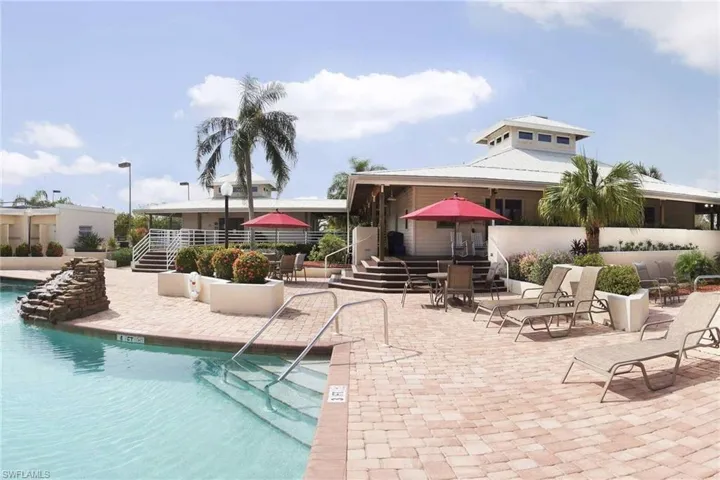 Community pool with a patio