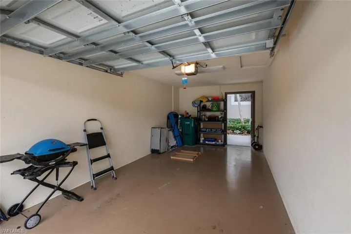 Garage featuring a garage door opener