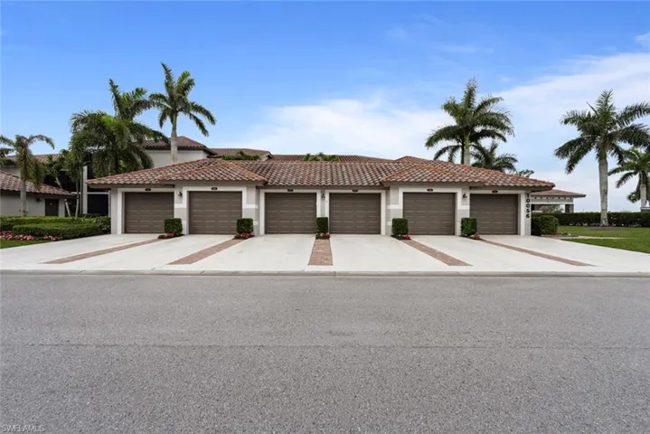 Mediterranean / spanish house featuring a garage