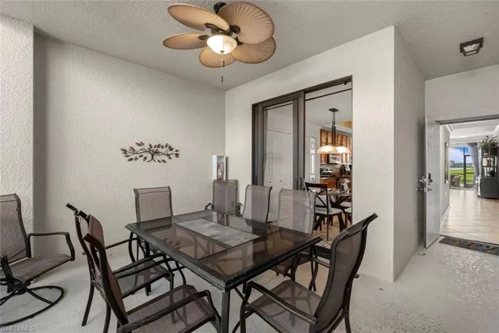 Dining space featuring a textured ceiling and ceiling fan