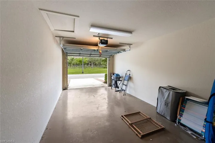 Garage featuring a garage door opener