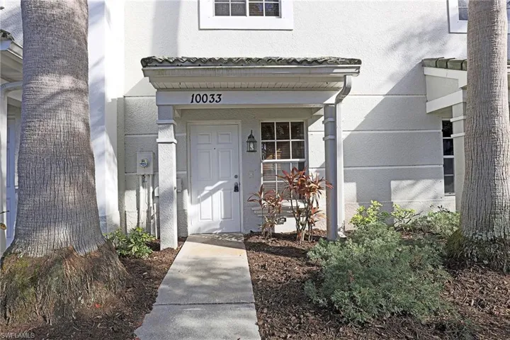 View of exterior entry with stucco siding