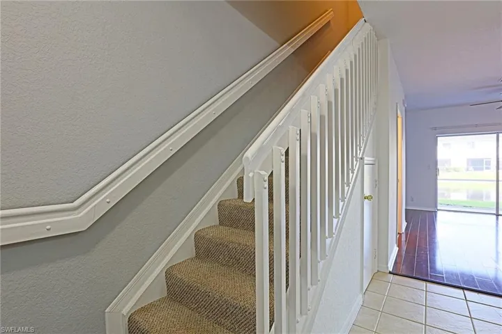 Staircase with tile patterned floors