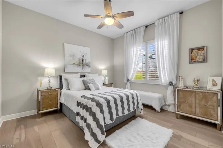 Bedroom featuring light wood finished floors and a ceiling fan