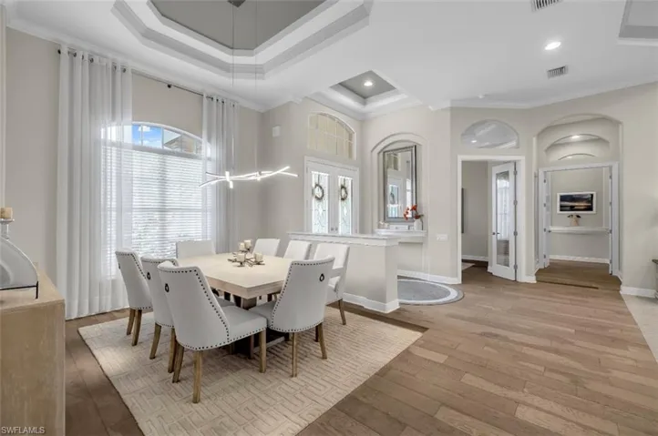 Dining room featuring ornamental molding and light wood-style flooring