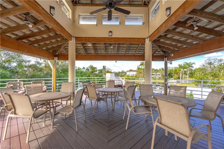 Wooden deck with ceiling fan and a gazebo