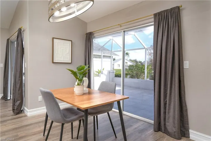 Dining room with light hardwood / wood-style floors