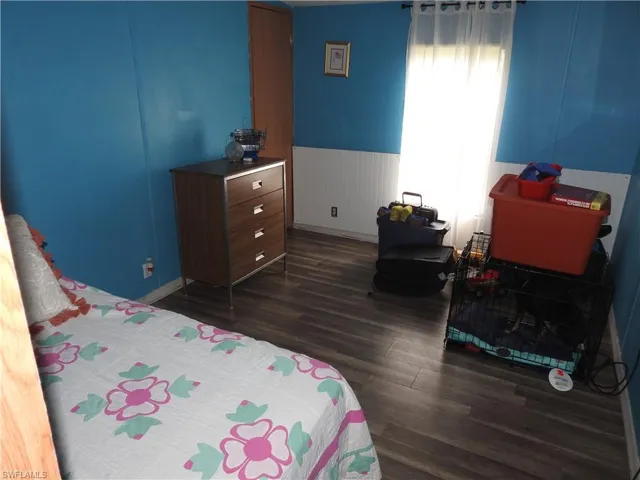 Bedroom featuring dark hardwood / wood-style floors