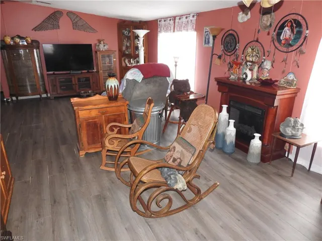 Living room with hardwood / wood-style flooring