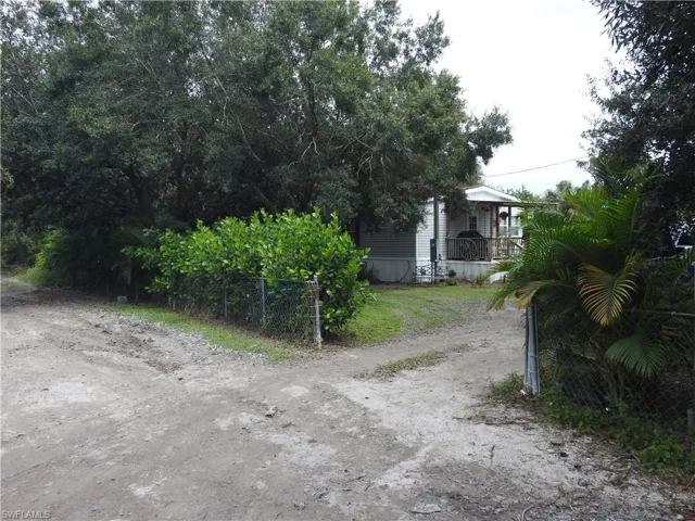 View of yard featuring covered porch
