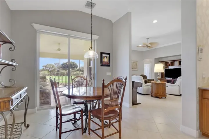 Dining area featuring ceiling fan, light tile patterned floors, and recessed lighting
