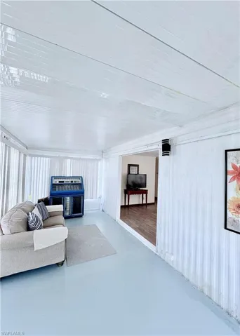 Living room featuring finished concrete flooring