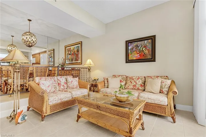 Dining and Living Room -Staged. Furnishings in the photo are not in place. Replaced with like-minded furniture.