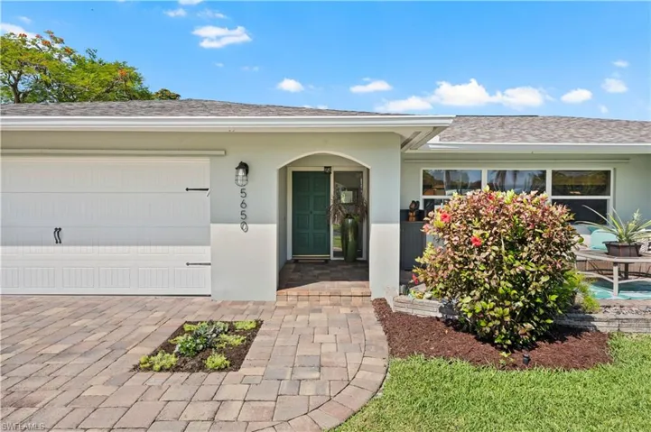 Property entrance with a garage