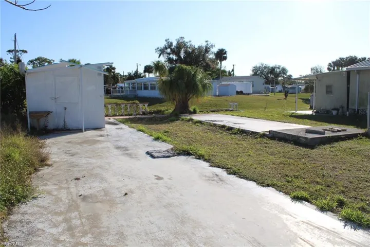 View of yard with a storage shed