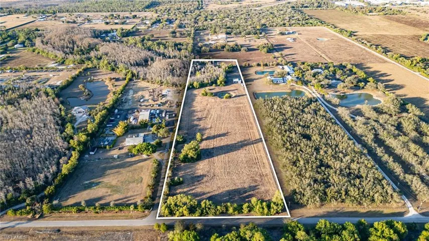 Overview of rural landscape with property parcel outlined and extensive farmland