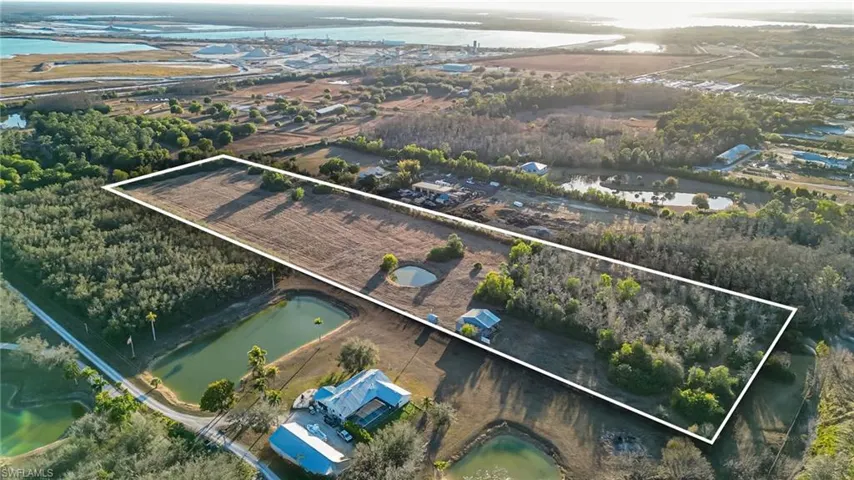 View of property location featuring a large body of water and property boundaries highlighted