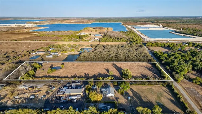 Aerial overview of property's location featuring property boundaries highlighted and a nearby body of water