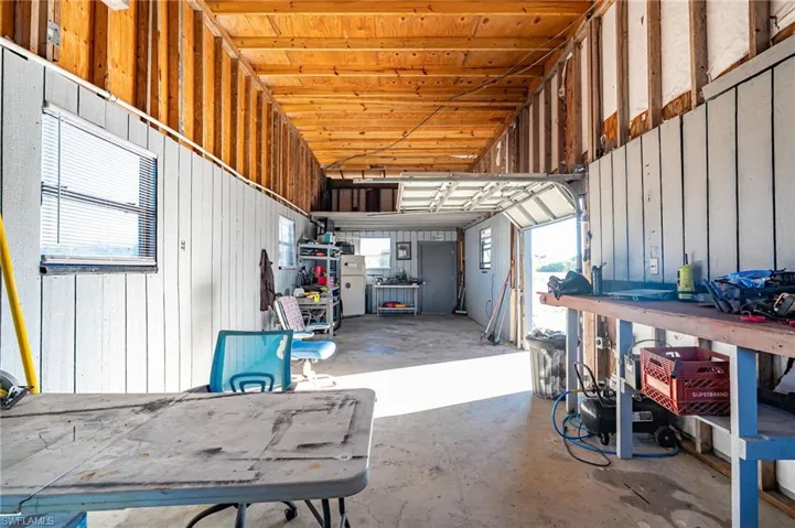 Garage with freestanding refrigerator