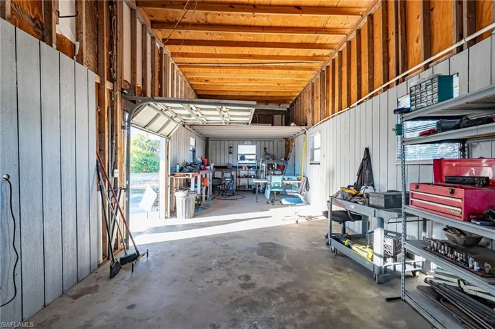 Garage featuring metal wall